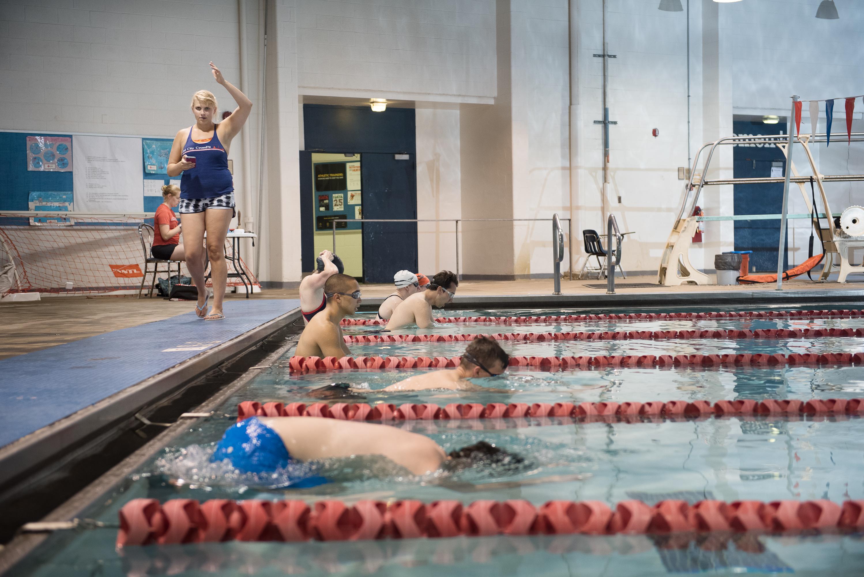 Adult learning to swim one-on-one with a coach at Old City Swim School