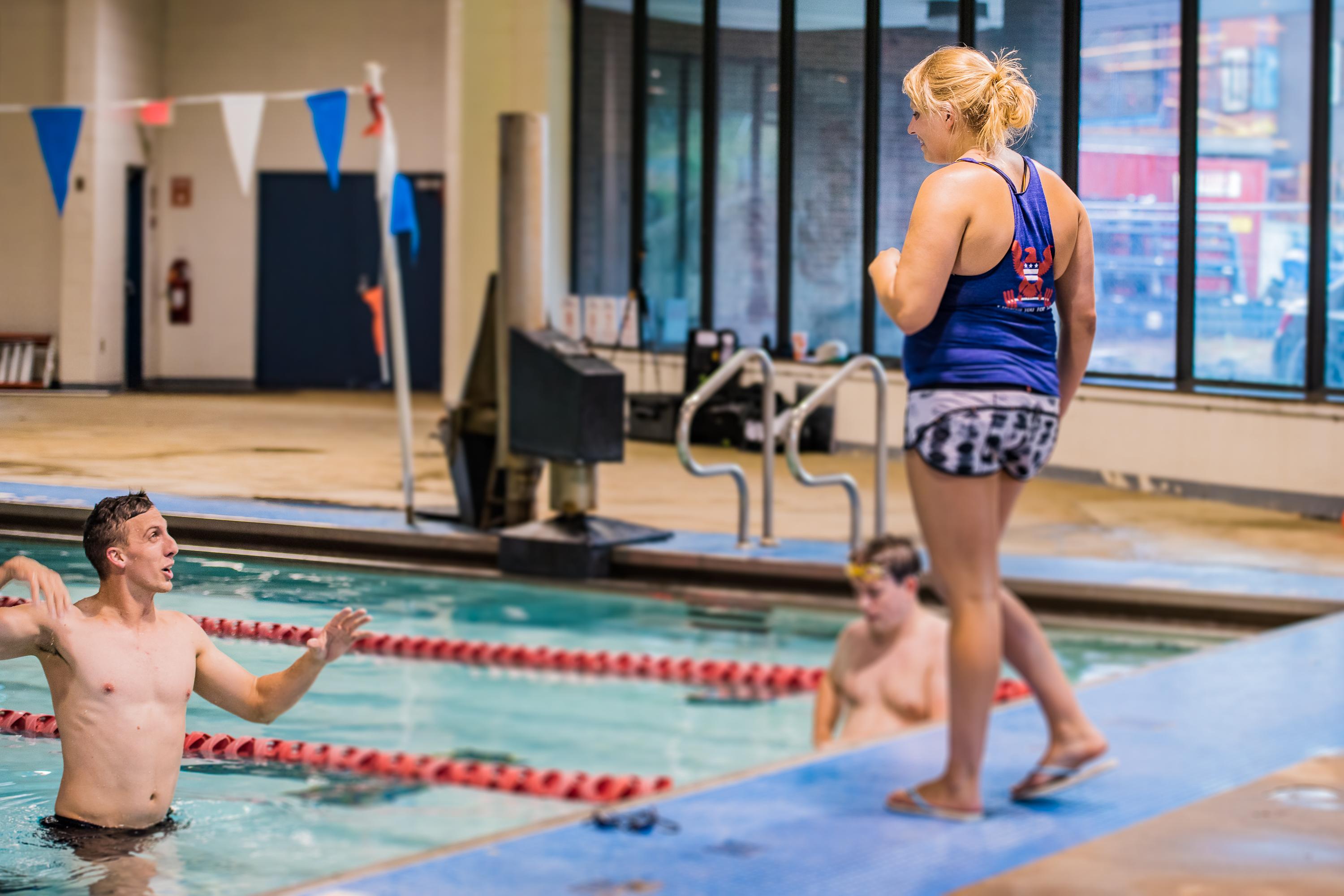 Adult swimmer working one-on-one with a coach at the Old City Swim School adult pool in Washington DC