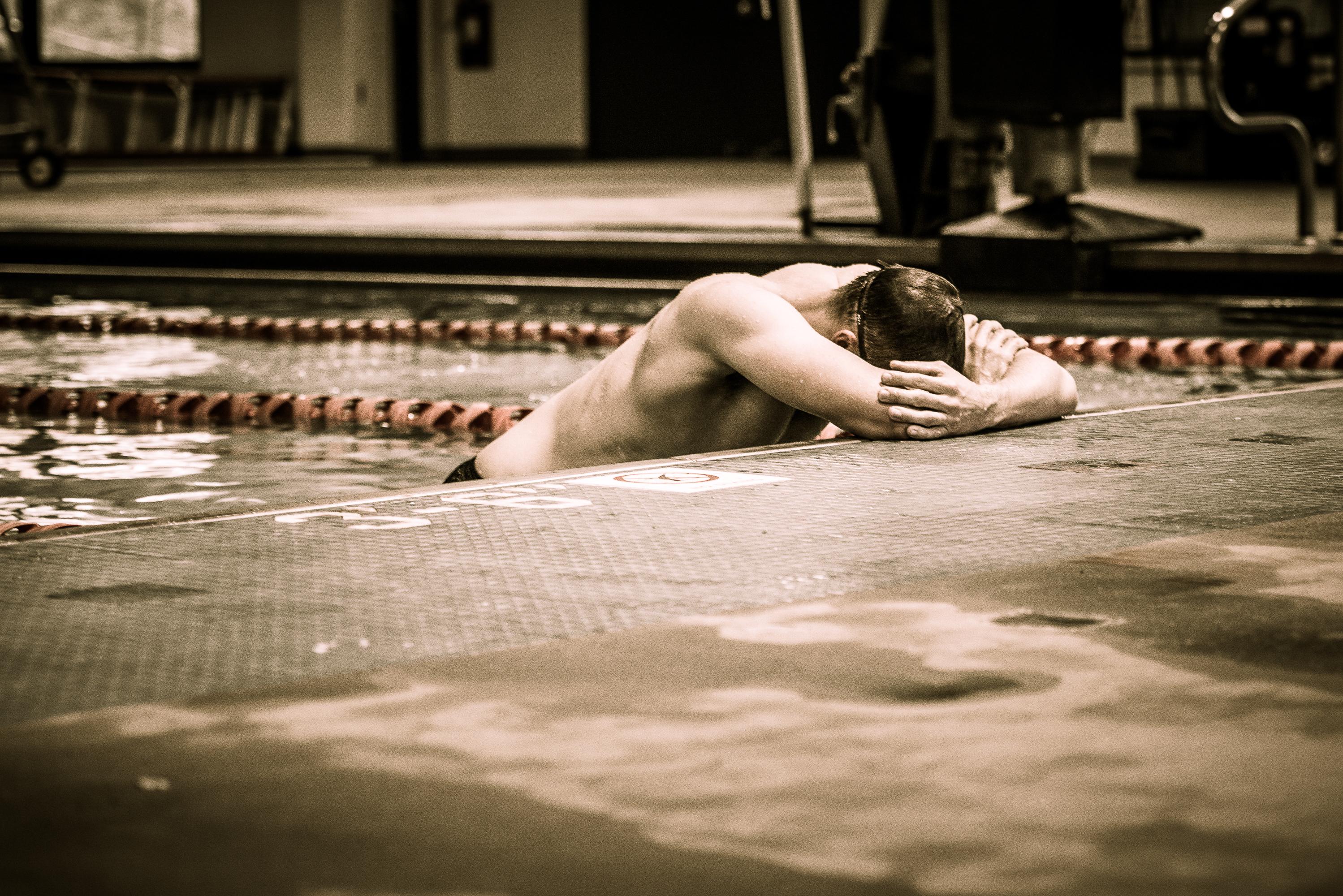 Adult swimmer training freestyle in a competition lane at Old City Swim School