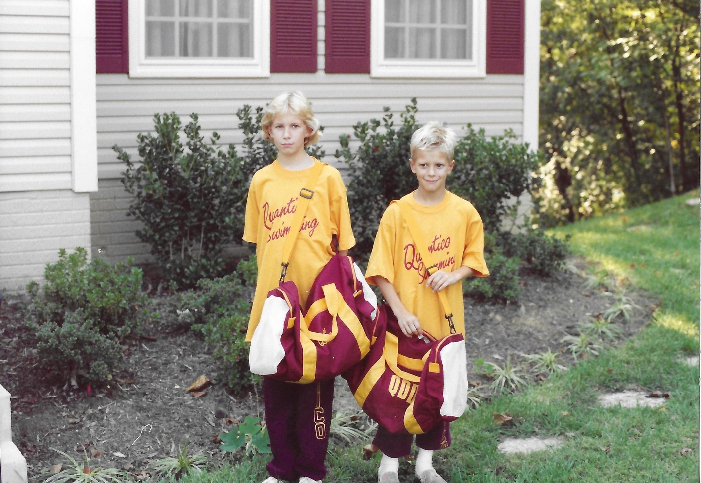 Young Sean Emery in a Quantico Swimming team shirt