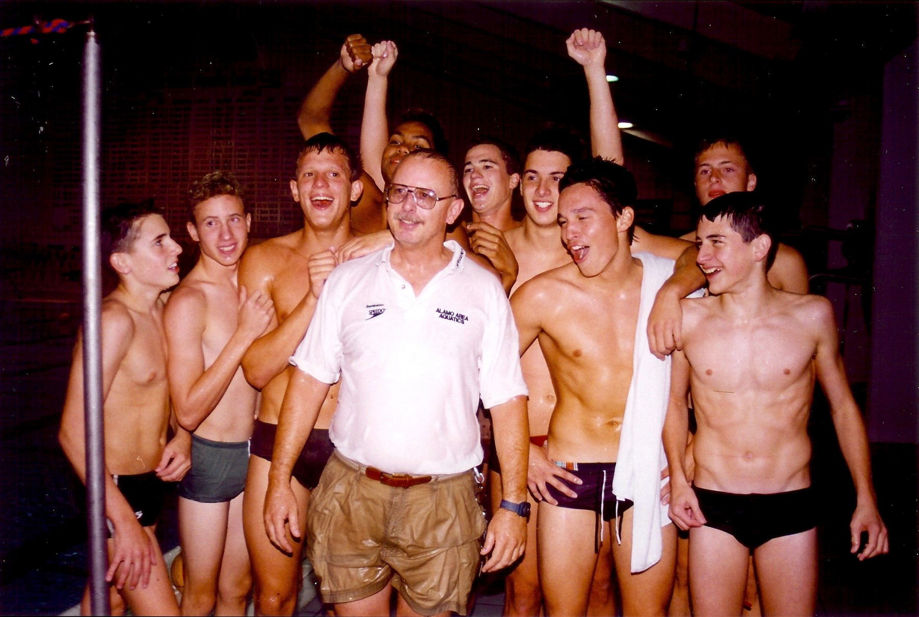Sean with his teammates and coach at Alamo Area Aquatics after a tournament win in San Antonio